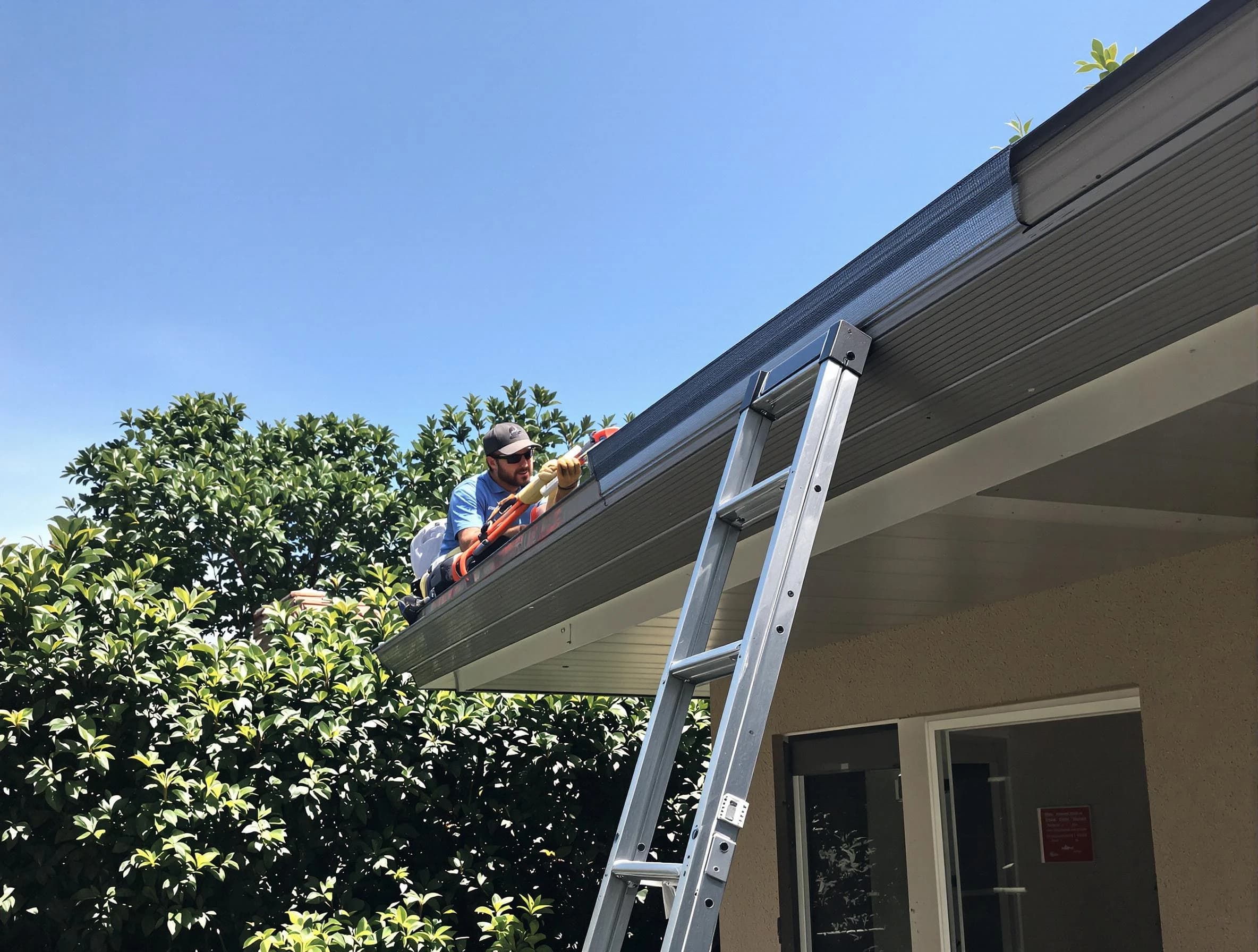 North Ridgeville Roofing Company installing gutter guards for a homeowner in North Ridgeville, OH